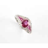 A fine white gold untreated Burmese ruby & diamond ring, the oval cushion cut ruby weighing