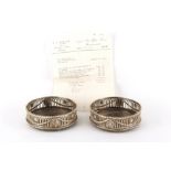 Property of a lady - a pair of George III silver coasters with turned wood bases, Robert Hennell,