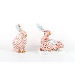 Property of a lady - two Herend fishnet models of rabbits, both 5.35ins. (13.6cms.) high (2).