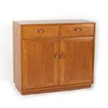 Property of a deceased estate - ensuite with the preceding lot - an Ercol elm side cabinet with