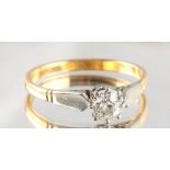 An 18ct yellow gold & platinum diamond single stone ring, the round brilliant cut diamond weighing