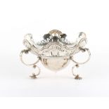 Property of a gentleman - an Edwardian silver three handled bowl, on shell feet, Elkington & Co.,