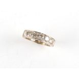 An 18ct white gold diamond half eternity ring, the seven round brilliant cut diamonds weighing a