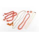 A coral graduated bead necklace, requires re-stringing, the largest beads approximately 15mm,
