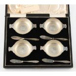 Property of a lady - a cased set of four silver butter dishes & butter knives, with glass liners,