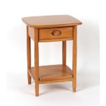 Property of a deceased estate - an Ercol elm two-tier bedside table with drawer, 19.5ins. (49.5cms.)