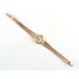 Property of a lady - a lady's Omega 9ct gold cased mechanical wristwatch on Omega 9ct gold