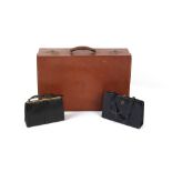 Property of a lady of title - a leather suitcase, previously with fittings, stamped A. Barrett &