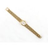Property of a lady - a lady's Baume & Mercier 18ct yellow gold cased quartz wristwatch on 18ct yello