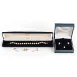 A 9ct gold bracelet set with 19 pearls, boxed; together with a pearl pendant set with a small