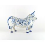 Property of a gentleman - a large 19th century Dutch Delft blue & white model of a bull,