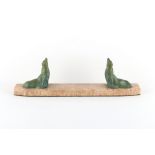 Property of a gentleman - an Art Deco bookstand modelled as a pair of painted spelter seals or
