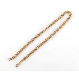 A 9ct gold watch chain, 16.25ins. (41cms.) long, approximately 53.6 grams.