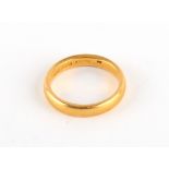 A 22ct yellow gold wedding band ring, approximately 6.7 grams, size P.