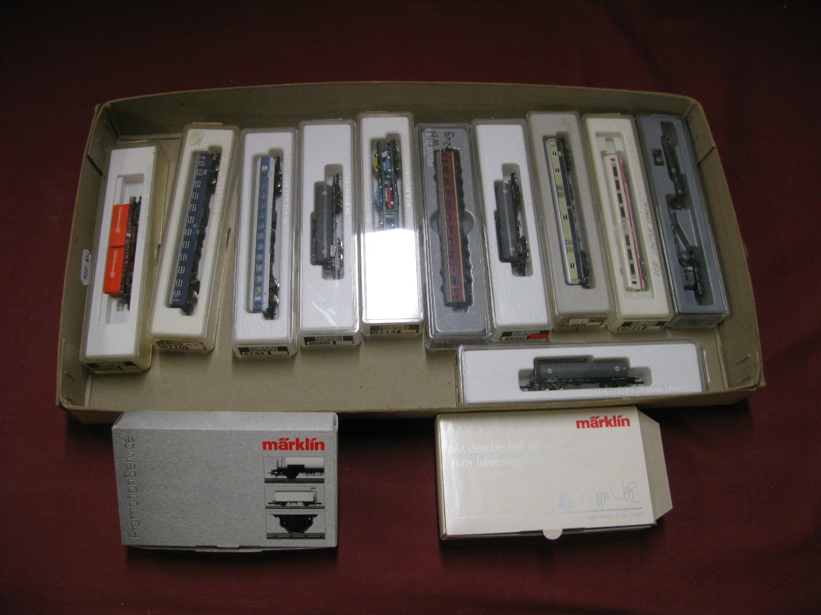Thirteen Marklin 'Z' Gauge Pieces of Rolling Stock, including coaches and wagons, all boxed.
