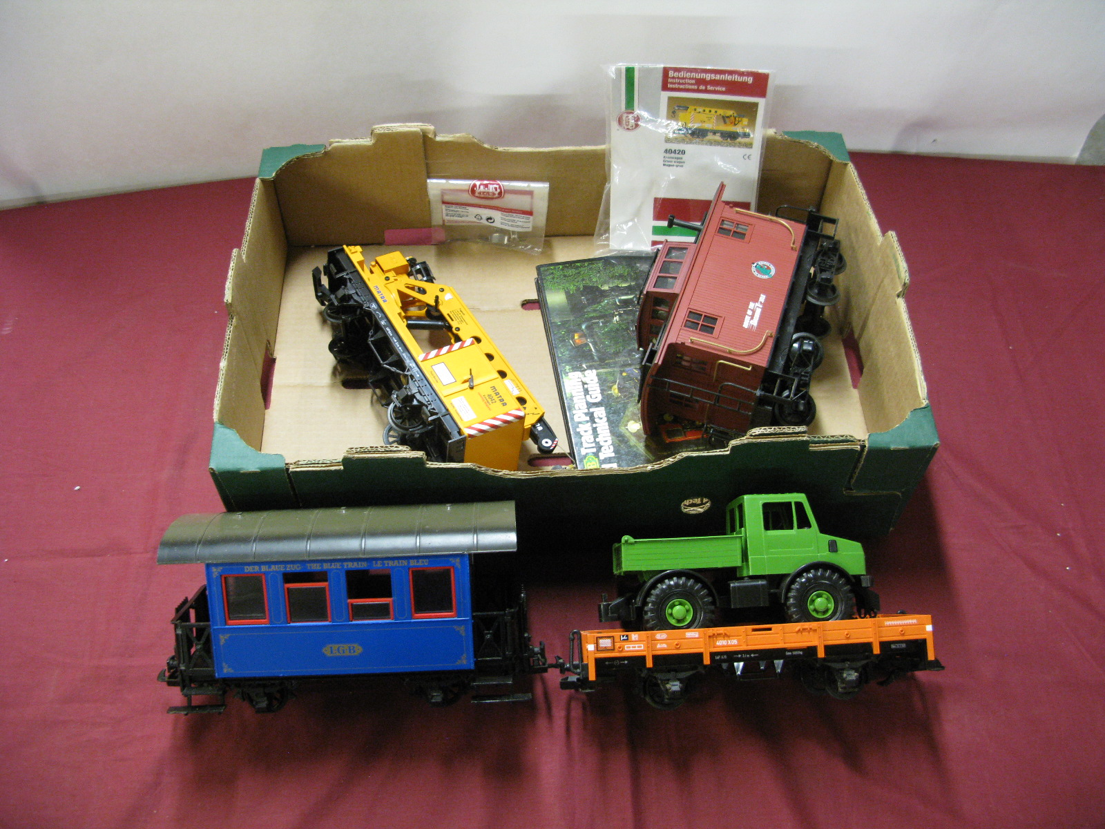 Four Loose 'G' Scale LGB Four wheel Wagons and Coaches, including crane wagon, all unboxed.
