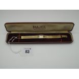 Majex; A Vintage 9ct Gold Cased Ladies Wristwatch, the signed rectangular dial with line markers,