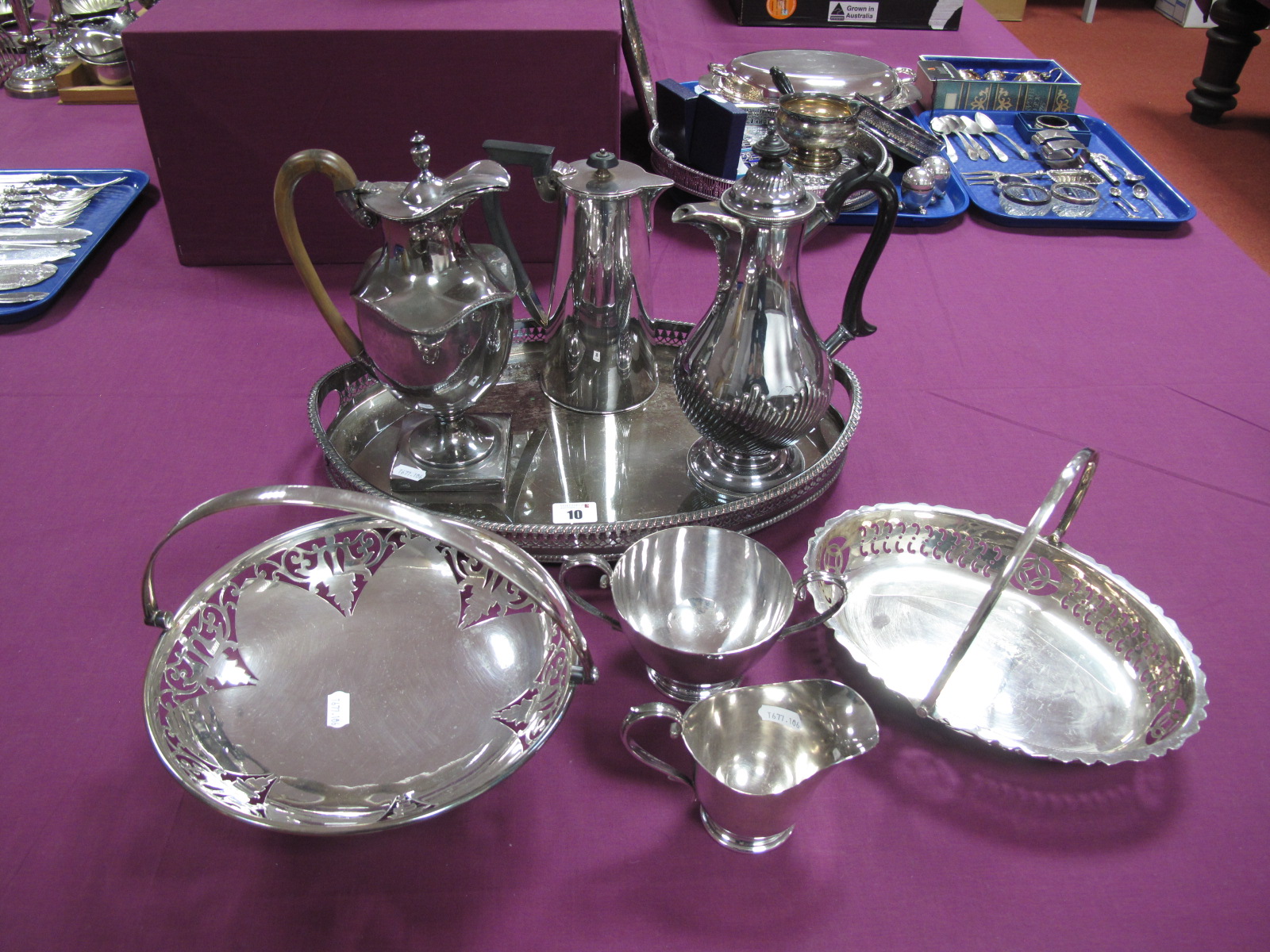 A Georgian Style Plated Lidded Water Jug, on square pedestal base, with high loop handle (cracked/