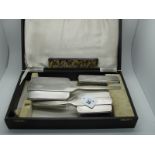 A Matched Hallmarked Silver Three Piece Dressing Table Set, Walker & Hall, Sheffield 1939, Chester