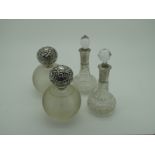 A Pair of Hallmarked Silver Topped Globular Glass Scent Bottles, London 1904; together with a pair