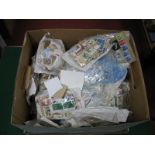 A Large Carton of GB and World Used Stamps, in packets and on album leaves, many thousands.