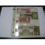 A Collection of Twenty Four Great Britain and Overseas Banknotes, including Banque D' Etat Du