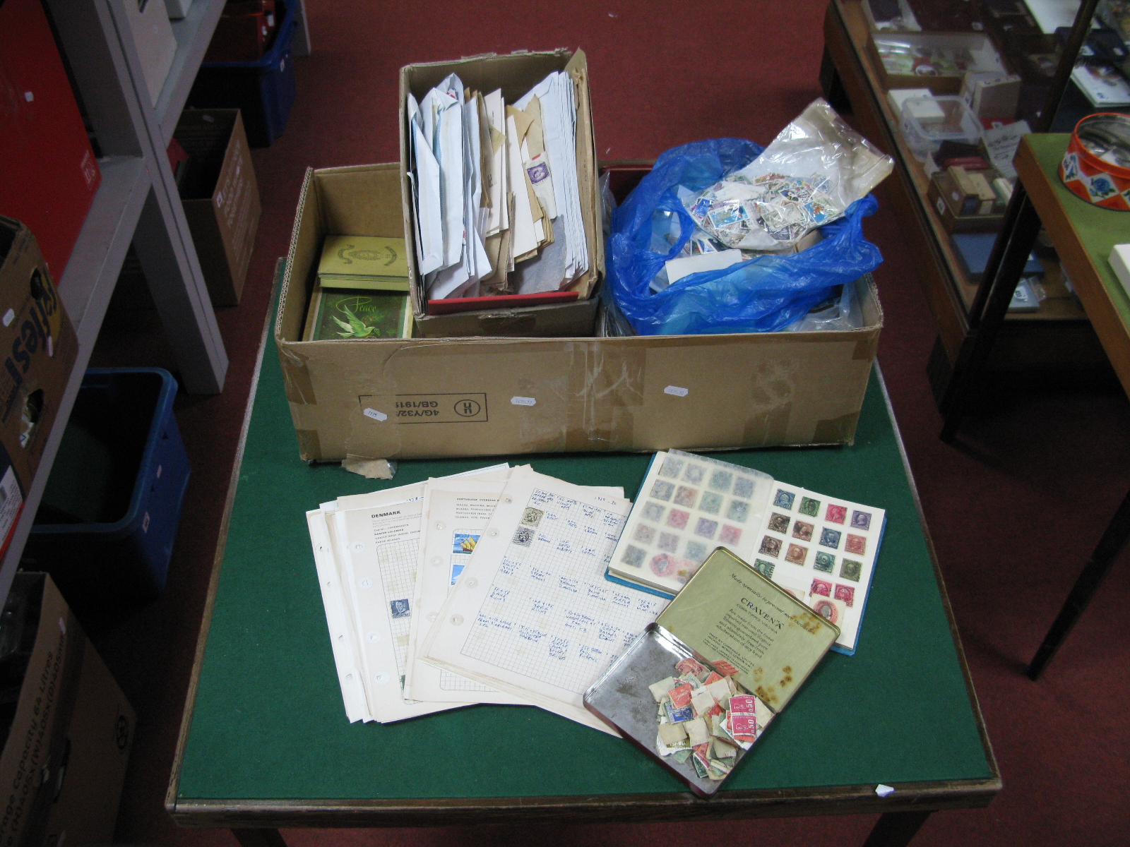 A Large Carton of GB and World Stamps, mainly used both some mint GB in small boxes, packets,