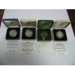 Four Cased Crown Sized Coins, to include silver proof G.B crown commemorating The Marriage of The