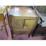 A Late XVIII Century Mahogany Commode, with a tray top over twin inlaid cupboard doors, single