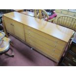 XX Century Teak Sideboard, with four drawers and twin cupboard doors, on square legs.