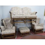 Ercol 'Old Colonial' Two Seater Settee, two armchairs and footstool.