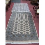 Pakistan Wool Tassled 'Pucha' Rugs, with many motifs on beige ground 184 x 122cm. (2)