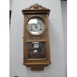 An Oak Cased Rectangular Style Wall Clock, with eight day movement, black Roman numerals to white