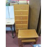 A Teak Chest of Seven Drawers; together with a nest of tables and a magazine rack. (3)