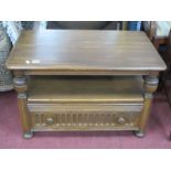 Ercol TV Stand, with drop leaf to fit in a corner, drawer with knulled decoration, on bun feet,