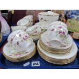 Diamond China Early XX Century Tea Ware, of thirty eight pieces, decorated with lilac flowers and