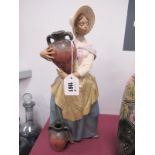 Lladro Pottery Figurine of a Lady Holding Ewer, impressed 2357, 37.5cm high.