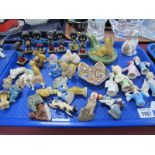 Wade Whimsies, terrier pipe stand, pin cushion dolls, seven Robertsons' figures, etc:- One Tray