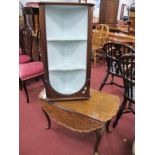 A XX Century Walnut Coffee Table, with drop leaves, pie crust edge, on carved cabriole legs, pad