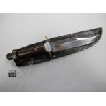 Bowie Knife Sheffield/England, 15cm blade, 26cm overall in a brown leather sheath.