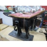 XX Century African Seat, with a carved elephant supporting dished seat.