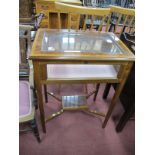 A XX Century Walnut Bijouterie Display Cabinet, the top with feather banding, on tapering legs