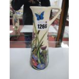 A Moorcroft Pottery Jug, painted in 'The Walnut Tree' design by Rachel Bishop, number 435, impressed