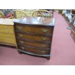 A Mahogany Bow Fronted Chest of Drawers, with four long drawers, on bracket feet.