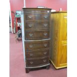 A Mahogany Bow Fronted Tallboy, with six small drawers, on bracket feet.