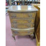 XX Century Walnut Chest of Drawers, with crossbanded top over four small drawers, on cabriole legs.