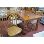 A Pine Rectangular Topped Kitchen Table, four spindle back chairs and two others. (7)