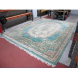 Chinese Tassled Wool Carpet, in green, with all-over floral decoration and large central bouquet