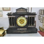 A XIX Century Black Slate Mantle Clock, with brass Corinthian columns and marble panels, eight day