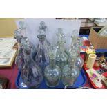 Eleven Glass Decanters with Stoppers.